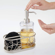 Load image into Gallery viewer, On amazon mdesign decorative wire kitchen sink countertop pump bottle caddy liquid hand soap dispenser with storage compartment holds and stores sponges scrubbers and brushes vine design clear satin